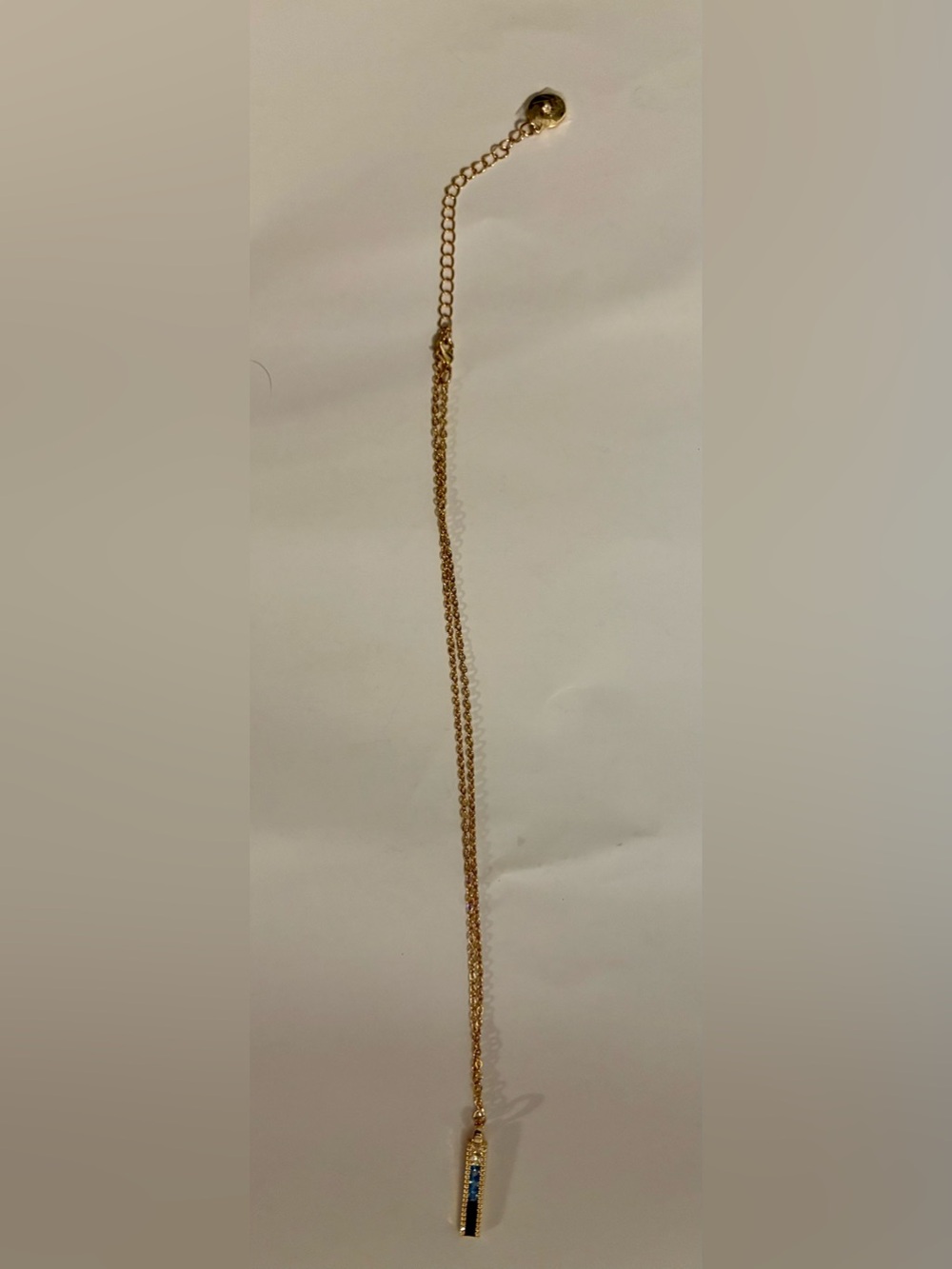 118- Vince Camuto Gold Bar Pendant Necklace with Blue CZ